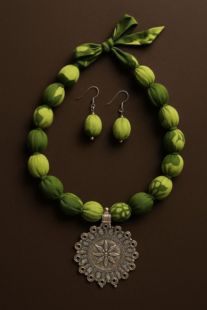 Green Cord With A Silver Colored Pedant Textile Jewelry